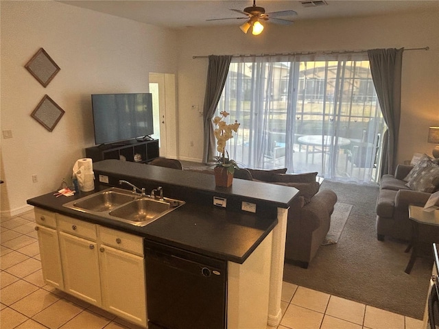 kitchen featuring dishwasher, a center island with sink, sink, ceiling fan, and white cabinetry