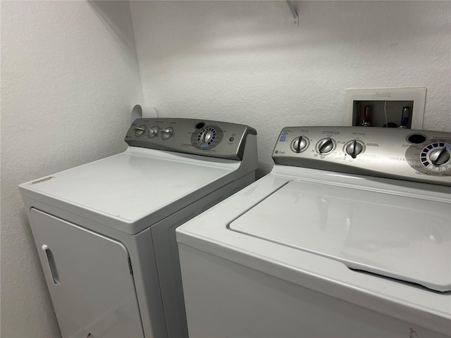 washroom featuring washing machine and dryer