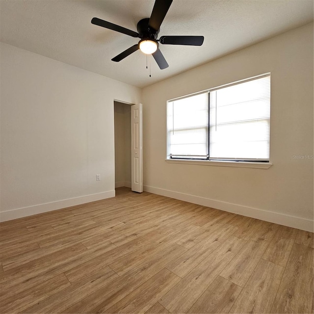 unfurnished bedroom with light wood-type flooring and ceiling fan