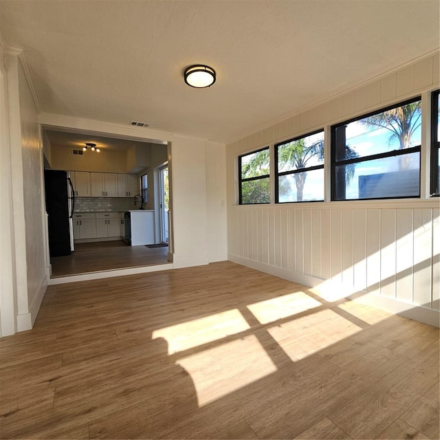 unfurnished living room with light wood-type flooring