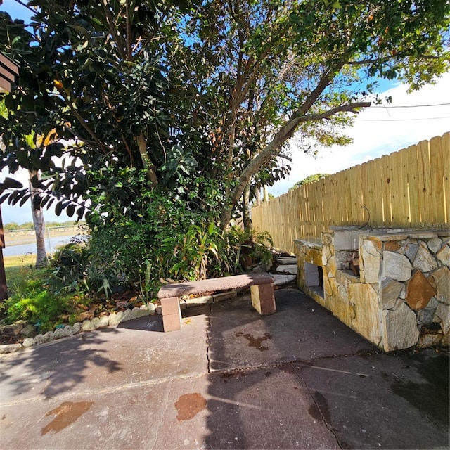 view of patio / terrace featuring a water view