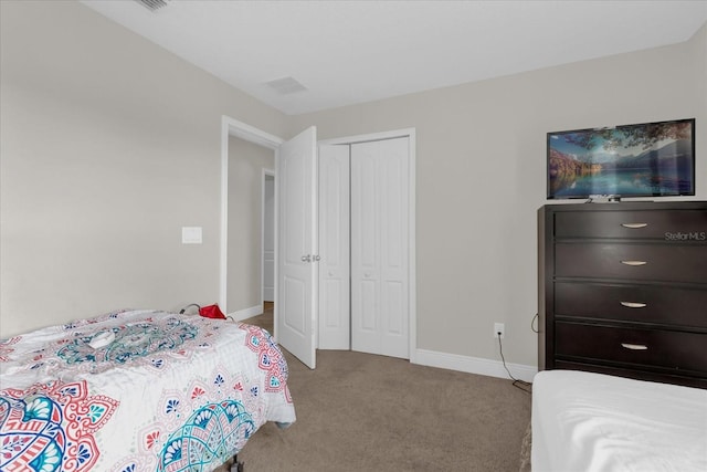 carpeted bedroom with a closet