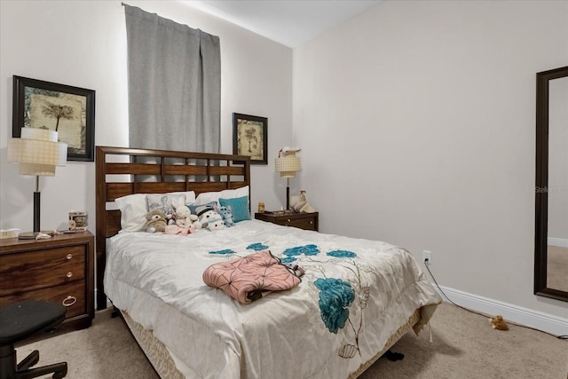 carpeted bedroom featuring lofted ceiling