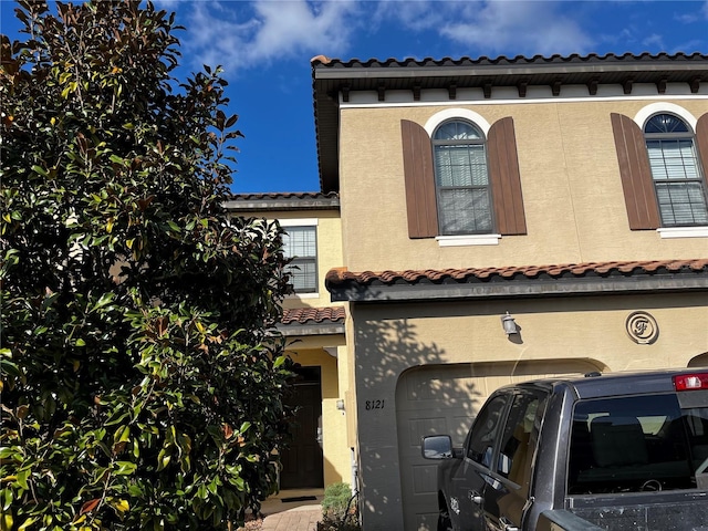 view of property exterior with a garage