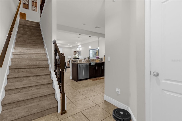 staircase featuring tile patterned floors