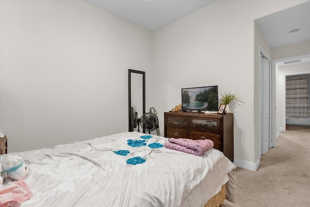 bedroom with light carpet