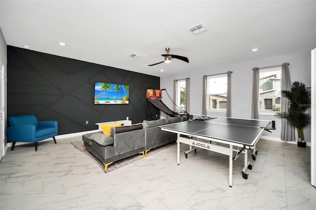 game room with ceiling fan