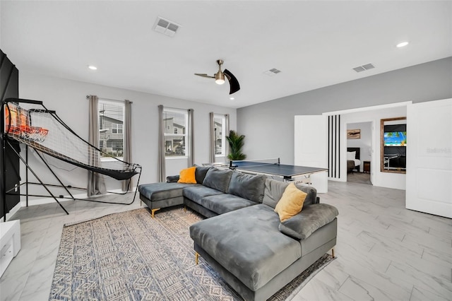 living room featuring ceiling fan