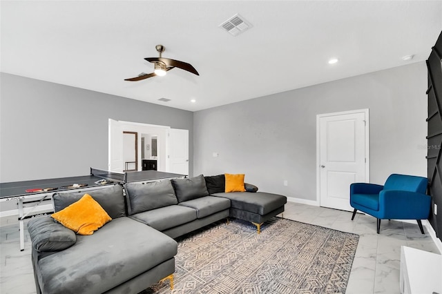 living room featuring ceiling fan