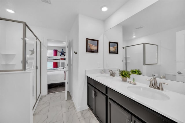 bathroom with vanity, toilet, and an enclosed shower