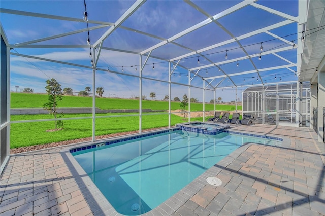 view of swimming pool with a patio area, a lanai, and an in ground hot tub