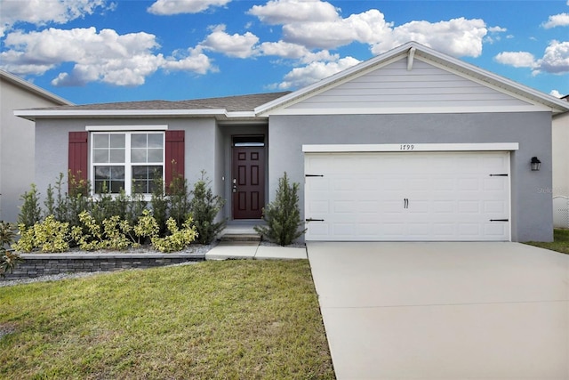 ranch-style home featuring a garage and a front lawn