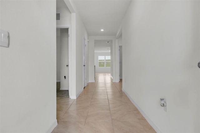 hallway with light tile patterned flooring