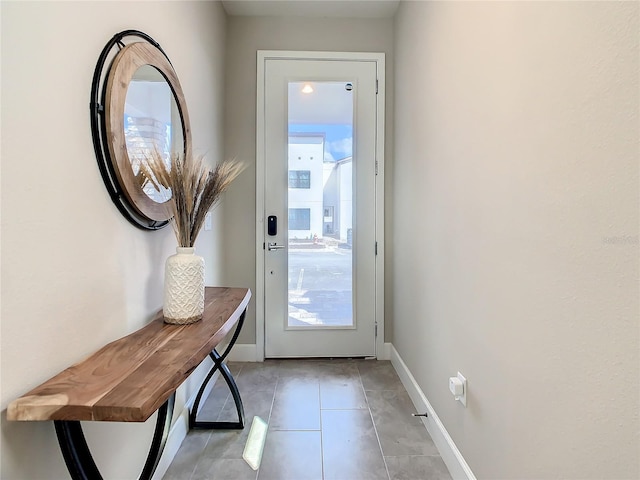 entryway with light tile patterned flooring