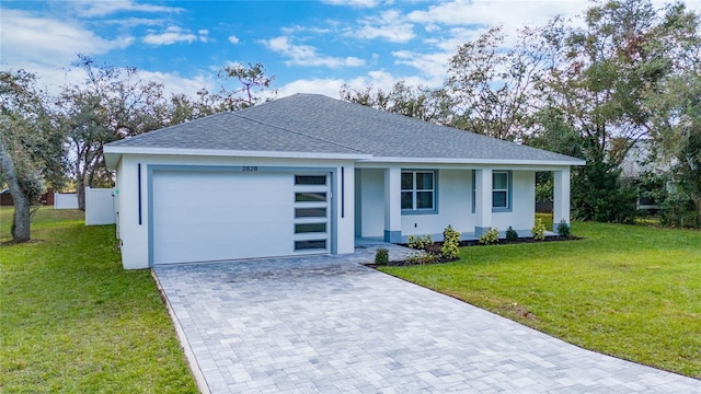 single story home with a front yard and a garage