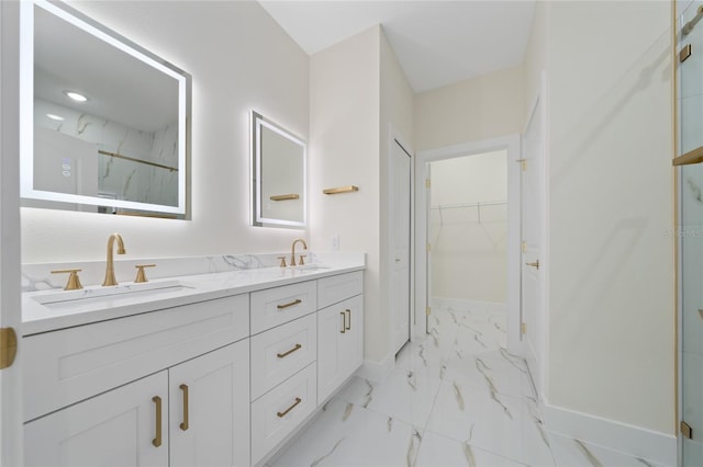 bathroom featuring a shower and vanity