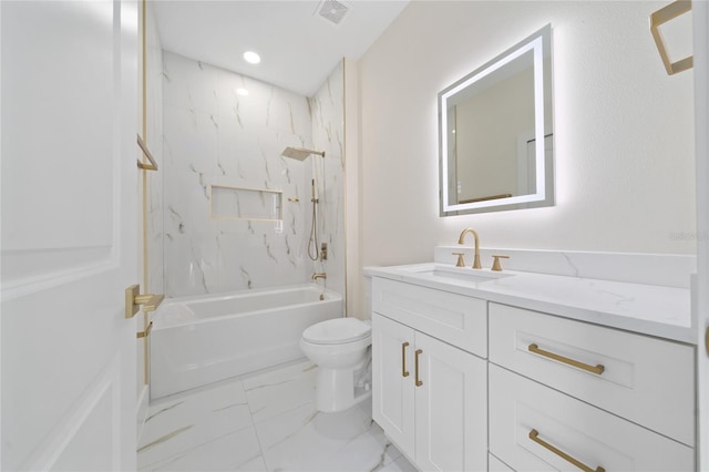 full bathroom with vanity, tiled shower / bath combo, and toilet