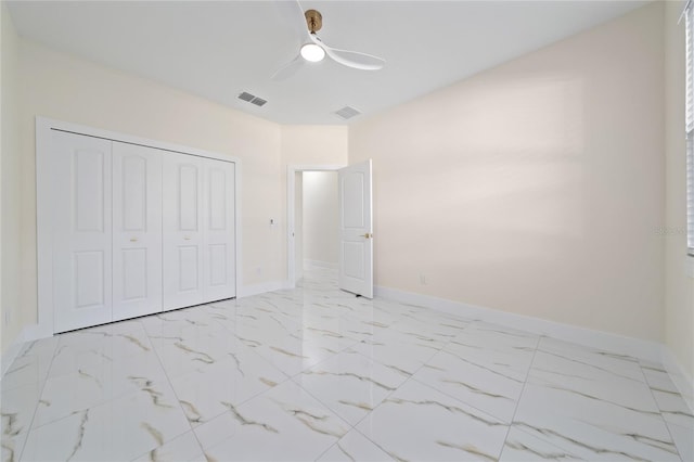 unfurnished bedroom featuring a closet and ceiling fan