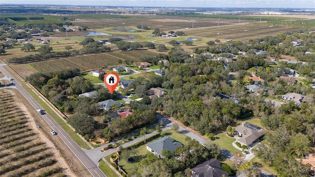 birds eye view of property with a rural view