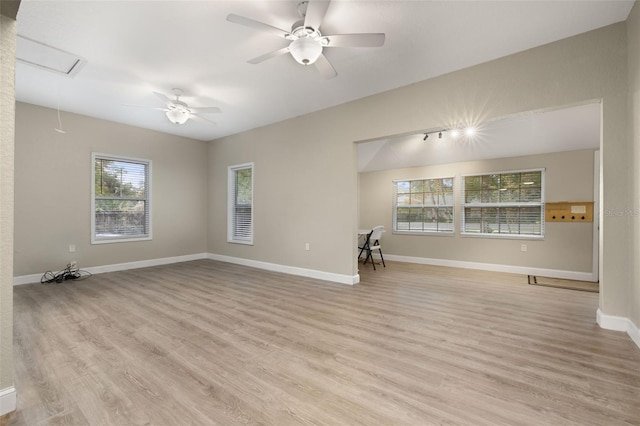 unfurnished room with light hardwood / wood-style flooring and ceiling fan