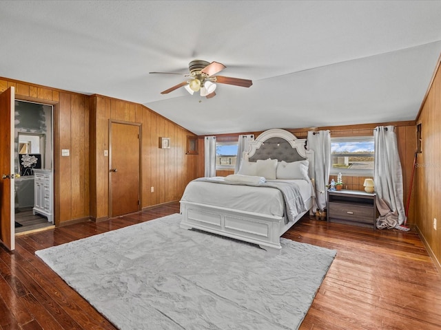 bedroom with multiple windows, ceiling fan, and dark wood-type flooring