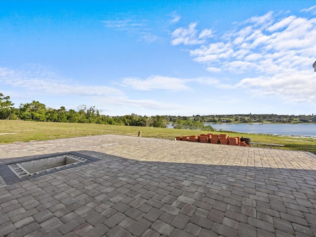 view of patio / terrace with a water view