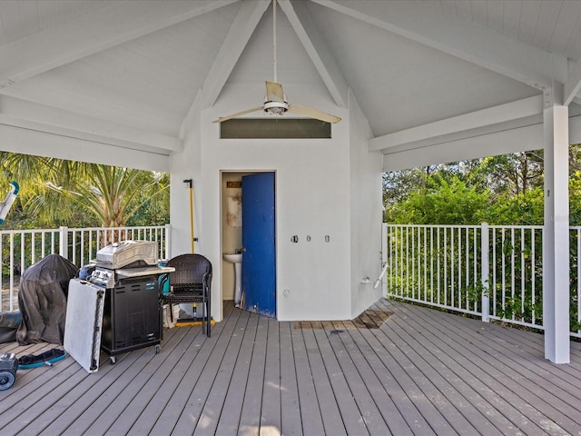 wooden terrace featuring ceiling fan