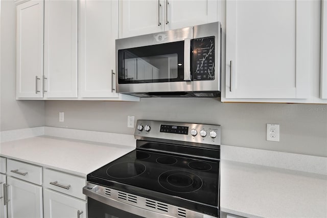 kitchen with white cabinets and stainless steel appliances