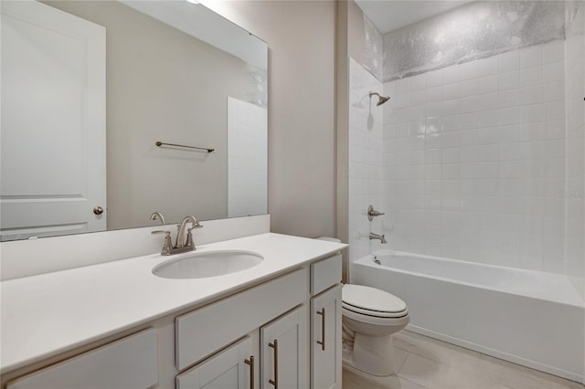 full bathroom with tile patterned floors, vanity, toilet, and tiled shower / bath