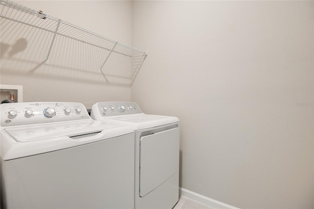 laundry room featuring separate washer and dryer