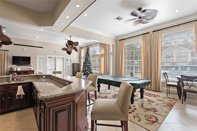 playroom with ceiling fan, crown molding, sink, light tile patterned floors, and pool table