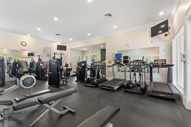 exercise room featuring crown molding