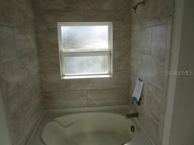 bathroom with shower / bath combination