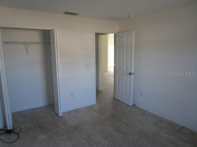 unfurnished bedroom featuring a closet