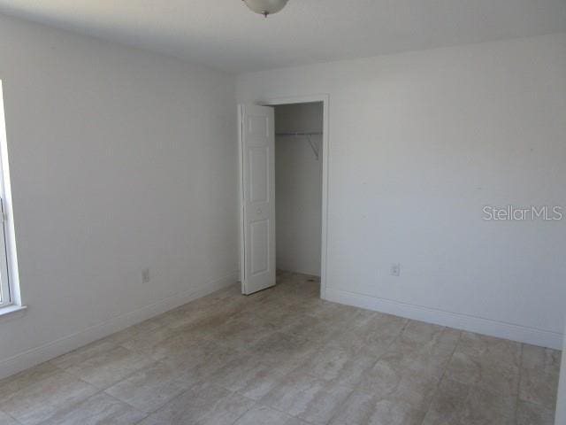 unfurnished bedroom featuring a closet