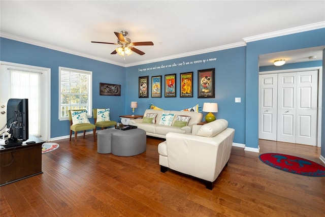 living room featuring dark hardwood / wood-style flooring, ceiling fan, and crown molding