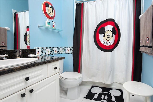 full bathroom featuring decorative backsplash, shower / bath combo, vanity, tile patterned flooring, and toilet