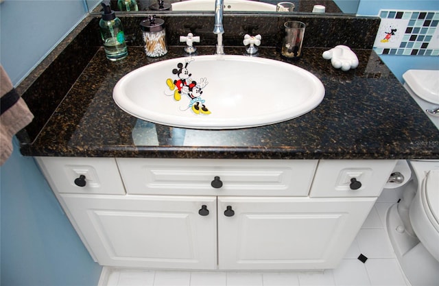 bathroom with vanity and tile patterned floors