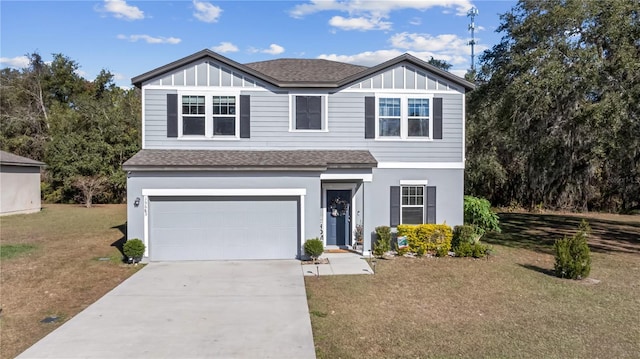 view of front facade with a garage and a front lawn