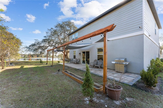 view of yard featuring a water view and a patio area