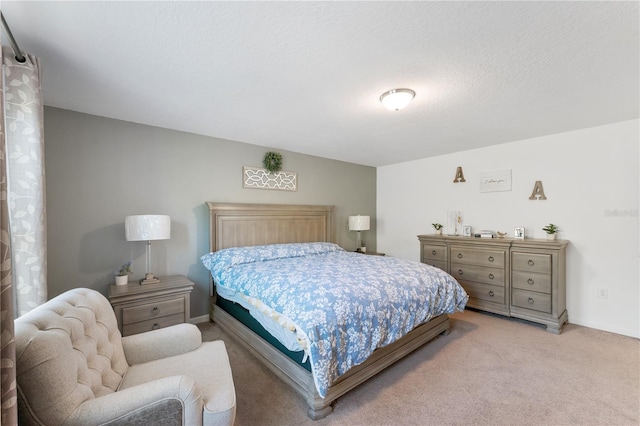 carpeted bedroom featuring a textured ceiling