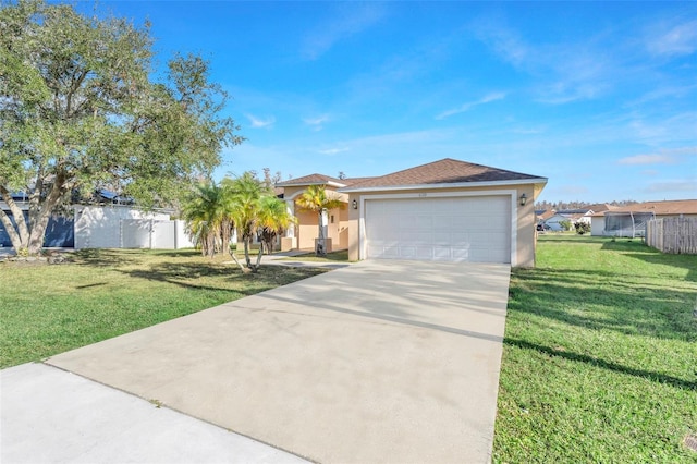 view of front of home featuring a garage and a front lawn