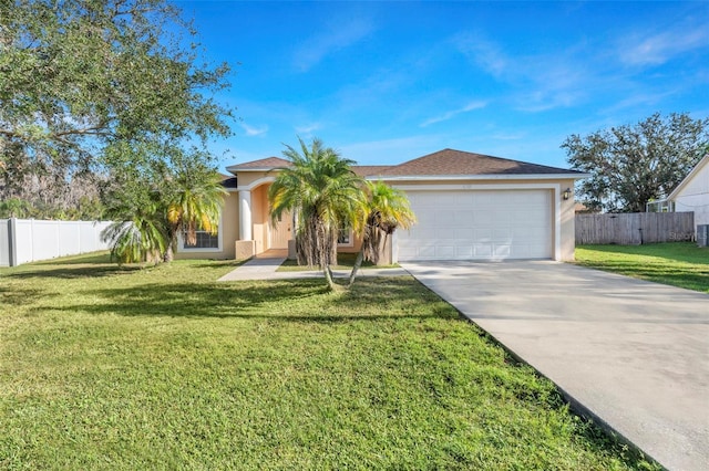 view of front of home with a front yard and a garage