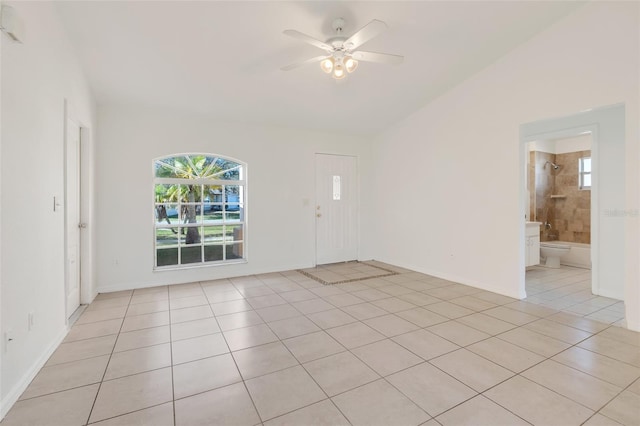 empty room featuring ceiling fan and light tile patterned flooring