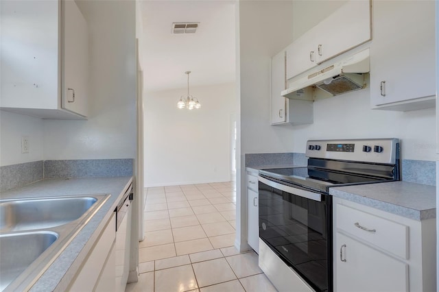 kitchen with pendant lighting, stainless steel range with electric cooktop, white cabinets, a notable chandelier, and light tile patterned flooring