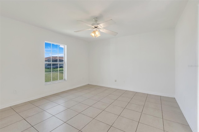 tiled empty room with ceiling fan