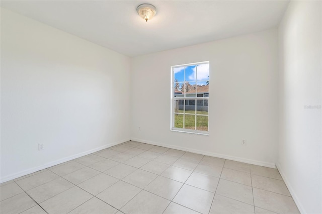 spare room with light tile patterned floors