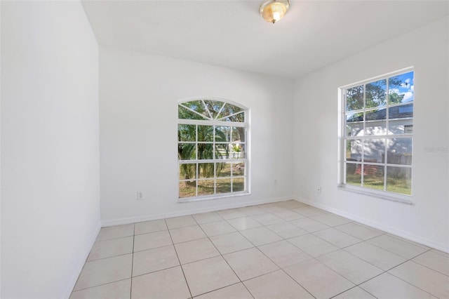 empty room with light tile patterned floors