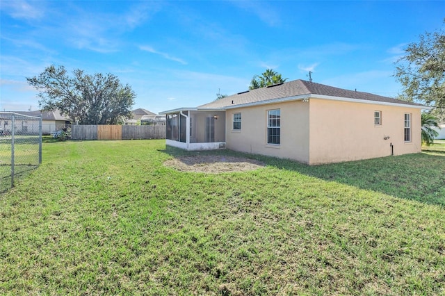 view of yard with a sunroom