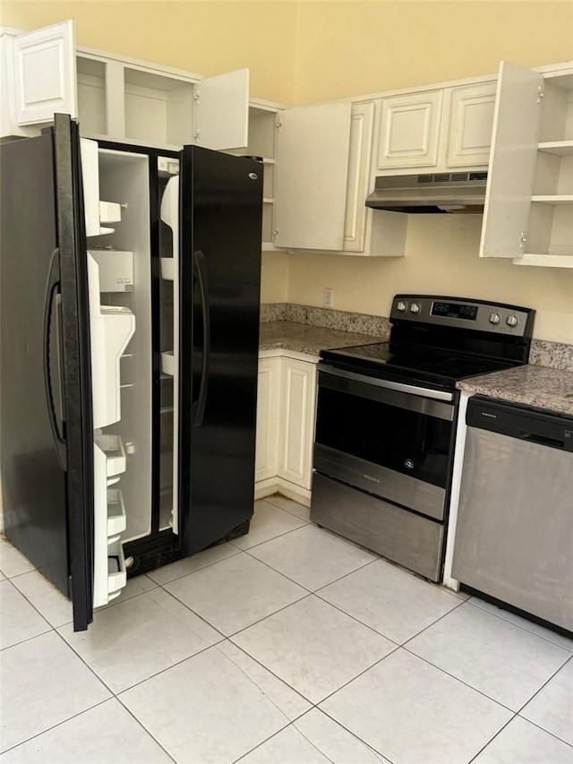 kitchen featuring light tile patterned floors and stainless steel appliances